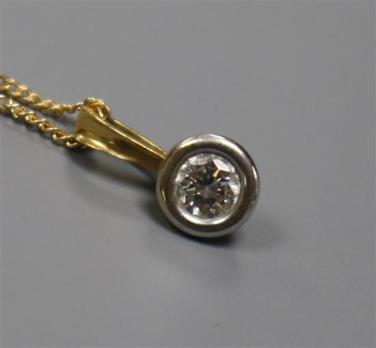 An 18ct gold and solitaire diamond pendant, on an 18ct gold fine link chain, pendant 12mm.